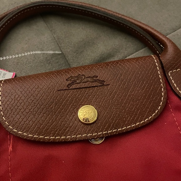 Longchamp handbag. Leather handles and flap. Interior pocket. 4” drop handles. - Picture 3 of 3